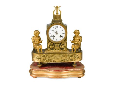 A French Empire style ormolu mantle clock, 19th century,  the base surmounted with a pair of children reading, the books bear