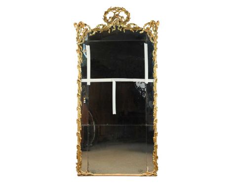 A carved giltwood pier mirror, mid-19th century, of arched form, the multisectional plates within a pierced gilt frame decora