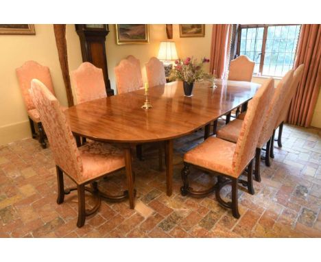 A set of twelve William & Mary style oak framed dining chairs, to include two carvers, the rectangular arched backs and seats