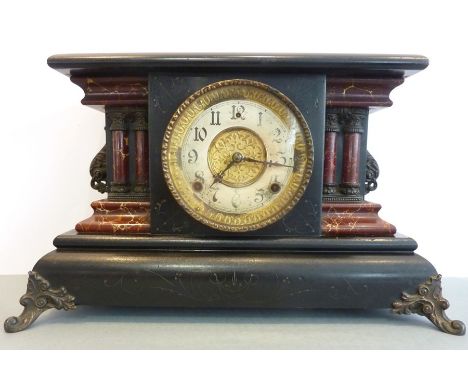 A decorative late 19th century ebonised and faux marble eight-day mantel clock on cast feet