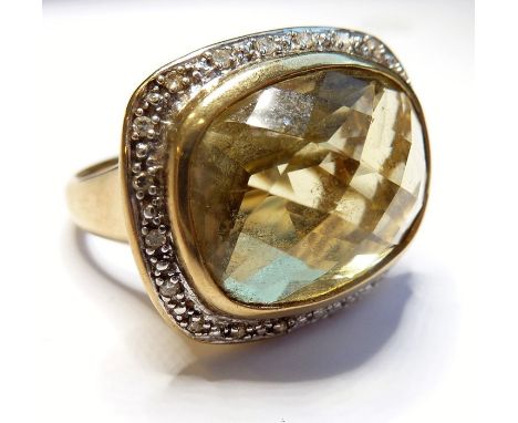 A heavy 9-carat gold ring set with large citrine and diamond border
(The cost of&nbsp;UK postage&nbsp;via Royal Mail Special 