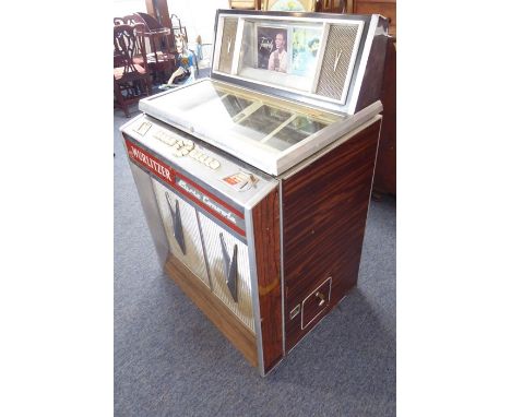 A Wurlitzer Lyric console Stereo De-Luxe jukebox for restoration (this item has recently been shipped from France and require