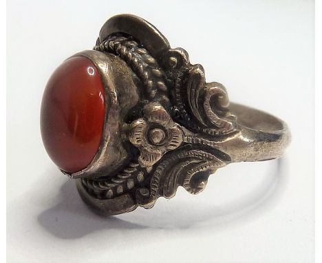 A white-metal ring set with an orange oval cabochon hardstone (boxed)
(The cost of&nbsp;UK postage&nbsp;via Royal Mail Specia