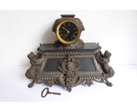 19th century eight-day French slate and metal-mounted mantel clock for restoration, the black dial with gilded Roman numerals