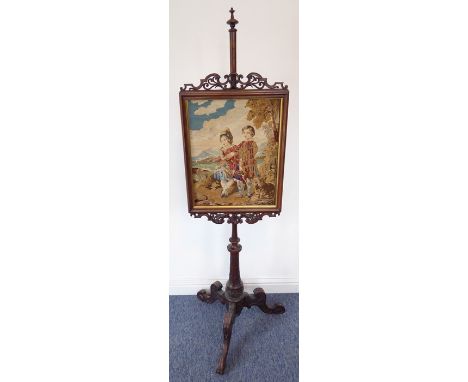 A fine early Victorian rosewood firescreen with a Scottish needlework tapestry depicting young children in tartan before wate