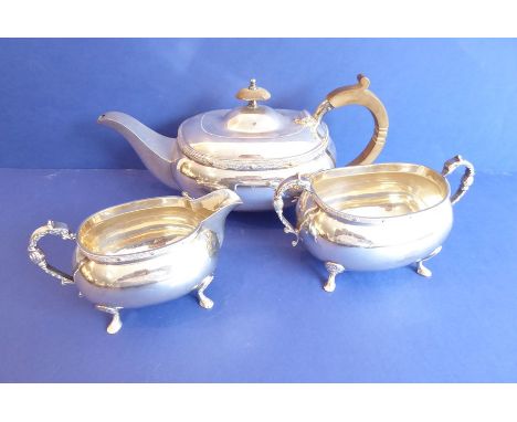 A Georgian-style (20th century) three-piece silver-plated tea service comprising teapot, two-handled sugar and creamer