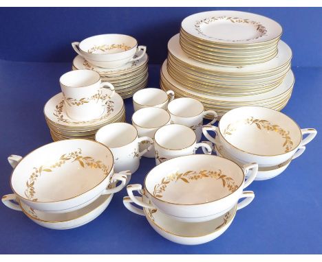 A Royal Worcester part-dinner service in the 'Saguenay' pattern comprising dinner plates, side plates, soup bowls, coffee can