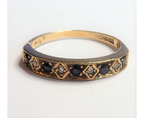 A 9-carat yellow-gold ring; horizontally set with five sapphires and four smaller diamond chips, ring size O
(The cost of&nbs