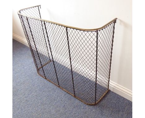 A late 19th/early 20th century brass-topped wire-mesh firescreen (90.5cm wide, 31cm deep, 76cm high)