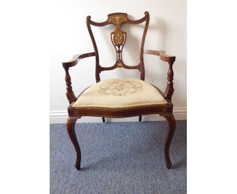 An elaborate Edwardian mahogany and bone-strung oak armchair; the top and crest rails decorated with scrolling foliage above 