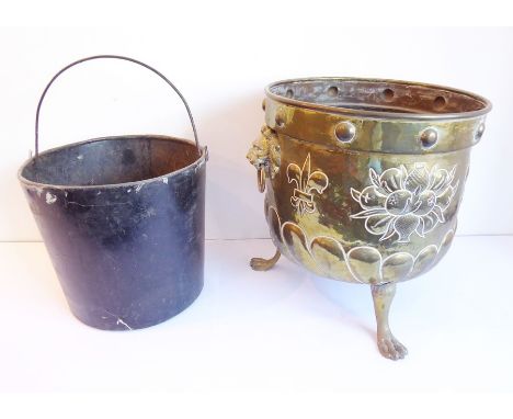 An early 20th century circular brass coal bucket with two lion mask and ring handles
