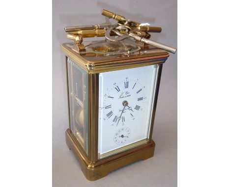 A fine-quality French brass and glass-sided carriage alarm clock; the white-enamel dial with Roman numerals and signed L'Epee