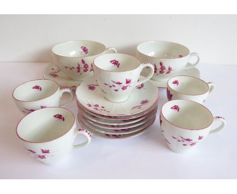A hand-decorated Chantilly part tea service comprising two large cups and saucers, six smaller saucers and five coffee cans