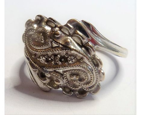 A white-metal (marked 14K) ring set with small white stones, ring size M/N
(The cost of&nbsp;UK postage&nbsp;via Royal Mail S