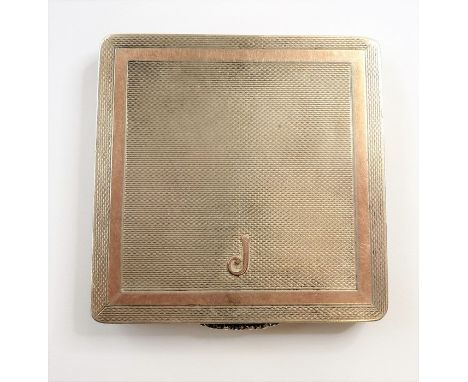 An&nbsp;engine-turned&nbsp;silver and gold compact with initial 'J'