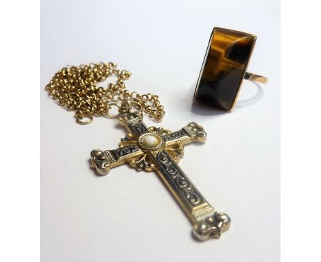 A yellow-metal ring set with a vertical polished tiger's eye, together with a white-metal crucifix centrally set with white c