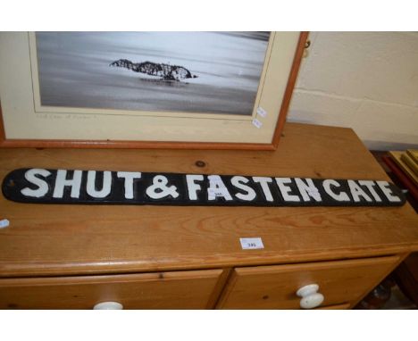 A cast iron sign marked "Shut and Fasten Gate", 80cm wide