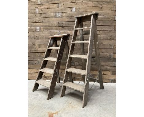 Two antique wooden step ladders, H100cm and 140cm