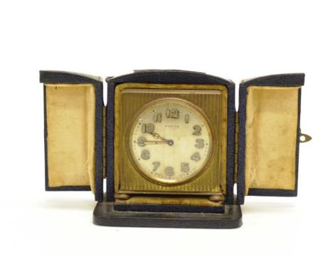 Vintage brass cased travelling clock marked 'Zenith,' to dial, (needs service), in fitted leather case, (height 6cm approx, c