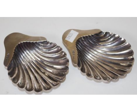 Pair Edward VII sterling silver butter dishes Sheffield 1903, makers Harrison Brothers &amp; Howson, each shell form, on 3 ba