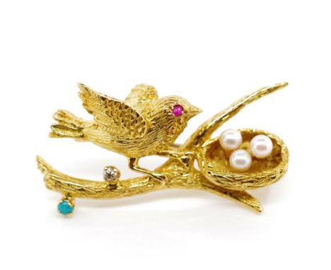 18ct yellow gold and multi gemstone set brooch depicting a bird tending to its nest, set with pearls, and a diamond, a ruby a