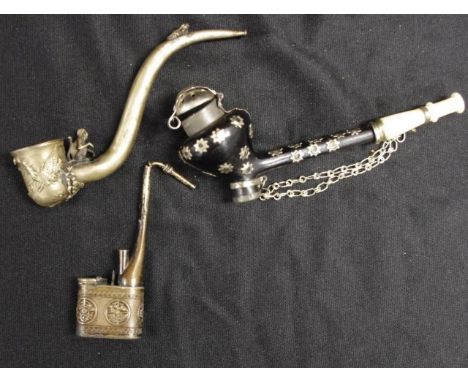 Three various Oriental opium pipes including 2 various white metal pipes, each with Chinese figure decoration, (length 13cm a