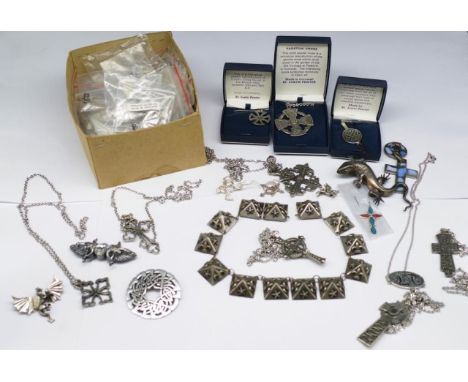 A group of pewter and silver jewellery includes, Celtic crosses, dragons, lizards, chains, brooches, some marked 925. Most st