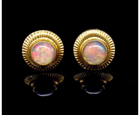 Opal and 8ct yellow gold stud earrings marked 333. Approx 6mm jelly opal cabochons weight 1.76 grams