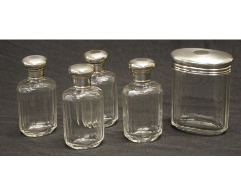 Set five Edward VII silver capped toilet bottles sterling silver caps marked for London  1908/9, maker Millar Wilkinson, to 1