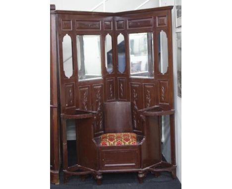 Early 20th century corner unit with mirrored and carved panels above a chair flanked by stick stands, 135cm wide, 199cm high 