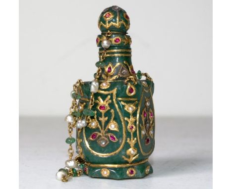 Bejeweled greenstone snuff bottle decorated with seed pearls and rough cut diamonds and red stones (some test as ruby) . One 