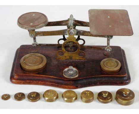 Vintage set postage scales brass scales, on wood base, with 3 weights; together with set of 8 brass weights, ranging from 2 g