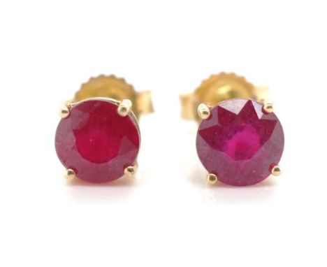 Ruby and 10ct yellow gold stud earrings marked 10k. Approx weight 0.88 grams, 4.8mm round cut rubies