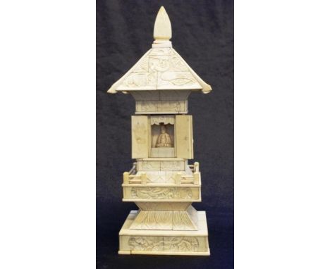 Oriental carved ivory &amp; bone temple carving to roof and base, with shrine opening from two doors to seated Buddha within,