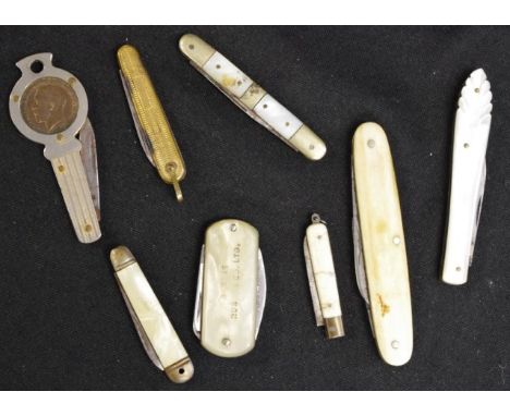 Collection eight vintage pocket knives each with decorative handle, including one with inset George V coin.