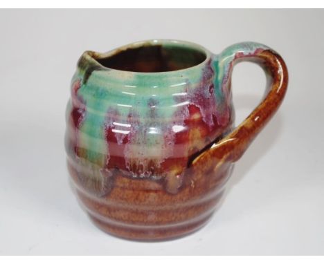 Vintage Remued  Australian pottery jug green and brown glaze, inscribed to base and # 116, (height 9cm approx).
