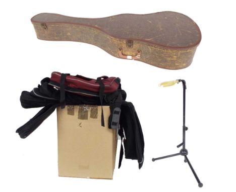 Vintage semi rigid acoustic guitar case, a guitar stand and ten various guitar soft bags