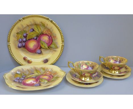 Aynsley Orchard Gold cups, saucers, tea plates, a bread and butter plate and a cabinet plate, signed D Jones 