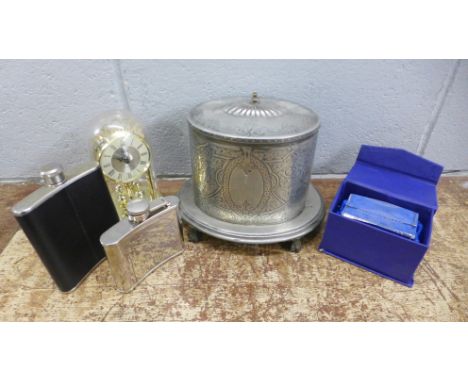 Two hip flasks, a quartz anniversary clock, a glass paperweight, boxed and a plated tea caddy **PLEASE NOTE THIS LOT IS NOT E