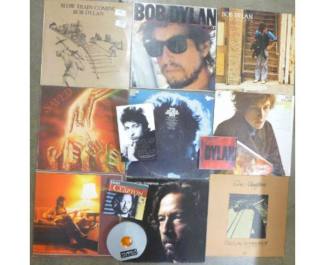 Twelve Eric Clapton and Bob Dylan LP records, CDs and two books 