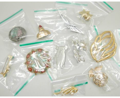 A collection of named costume brooches including Sarah Coventry, Miracle, Monet, Capri, Hollywood, etc. 