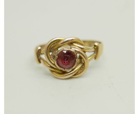 A Victorian 18ct gold ruby solitaire knot ring, Birmingham 1873, 2.6g, O 