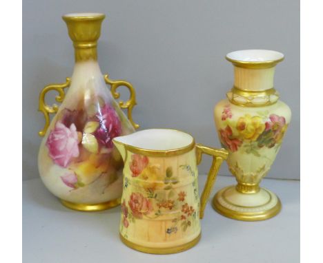 A Royal Worcester blush ivory small pitcher and two vases, all decorated with flowers 