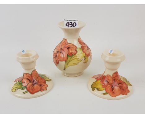 Moorcroft Hibiscus pattern vase (13cm): together with 2 candlestick holders (3). 