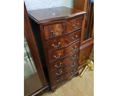 Flame mahogany chest of 6 drawers: raised on bracket feet, 49cm wide. 