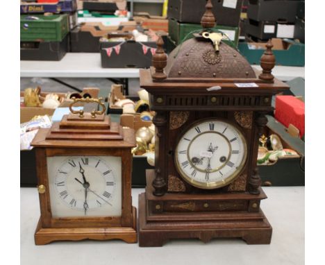 An Edwardian Junghan's mantel clock: 46cm in height, together with a quartz mantel clock (2). 