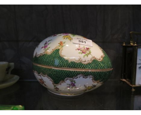 A Dresden box in the form of an egg, with floral painted decoration and green scale border, 18cm long