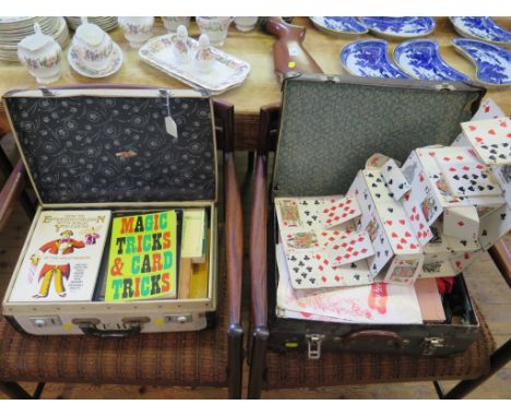 A small case of magic tricks and another case of books related to magic