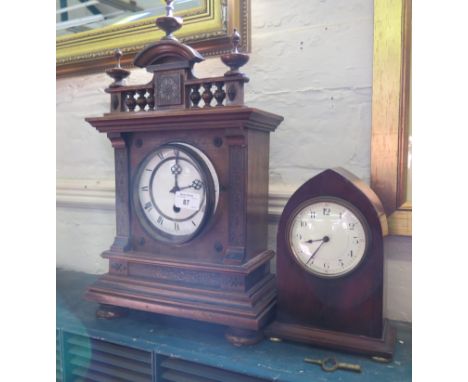 A lancet arched mahogany timepiece, with enamel dial and brass pad feet 22cm high, and a Victorian beech mantel clock with si