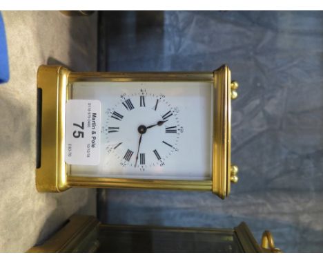 A brass carriage clock, with enamel dial, single train movement 15cm high